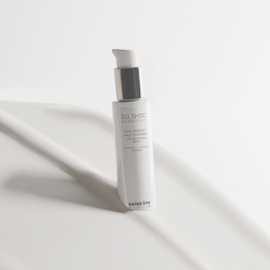 Cleanser bottle against milky texture