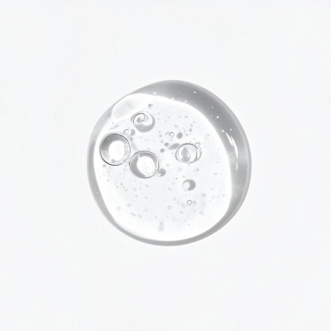 Clear liquid with bubbles on a white background - 360 Collagen Night Concentrate texture