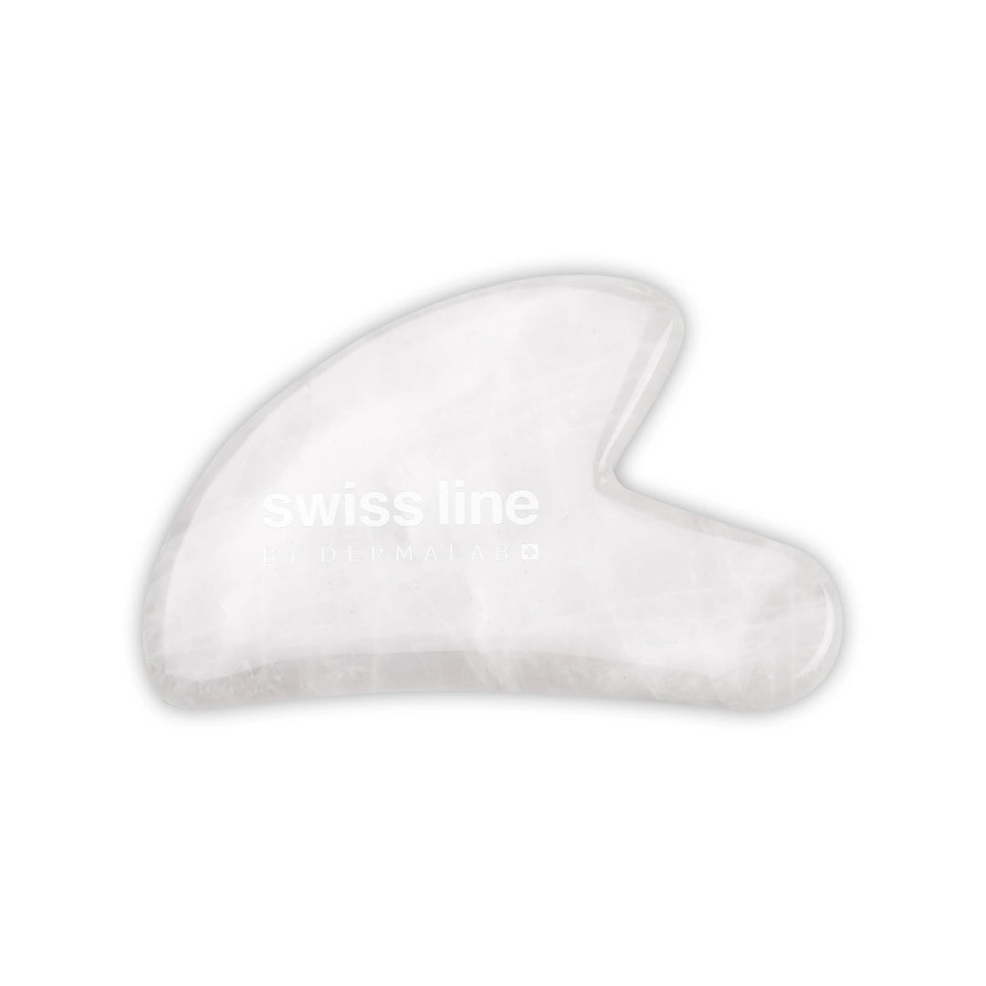 Transparent Gua Sha with Swissline by Dermalab written on it
