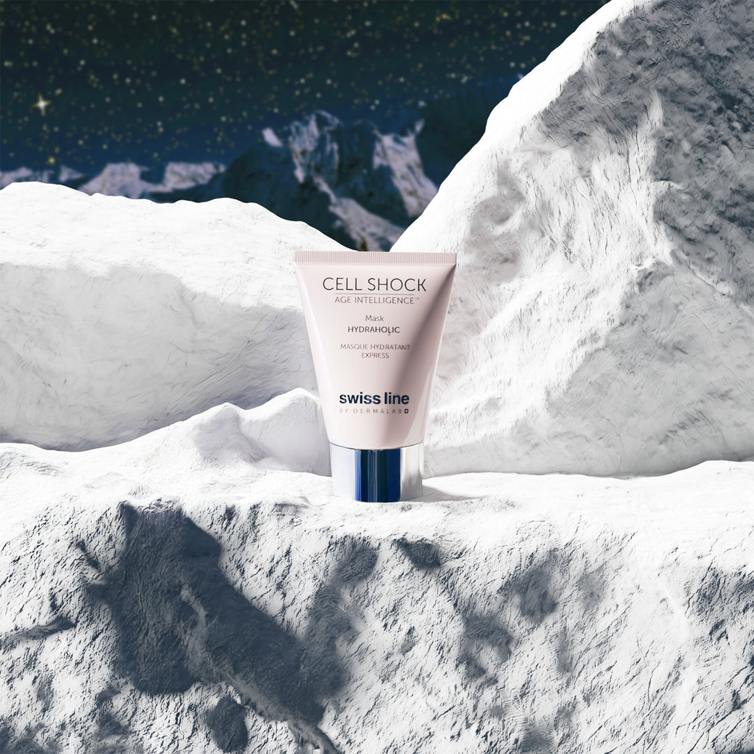 Swissline Cell Shock Age Intelligence bottle on a snowy mountain background