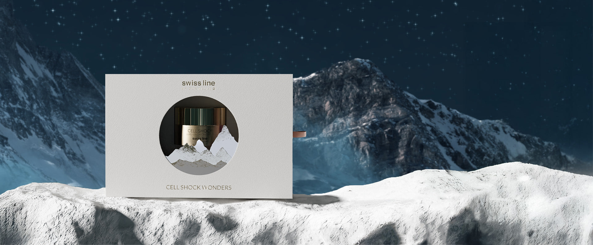 Product packaging on a snowy landscape with mountains in the background
