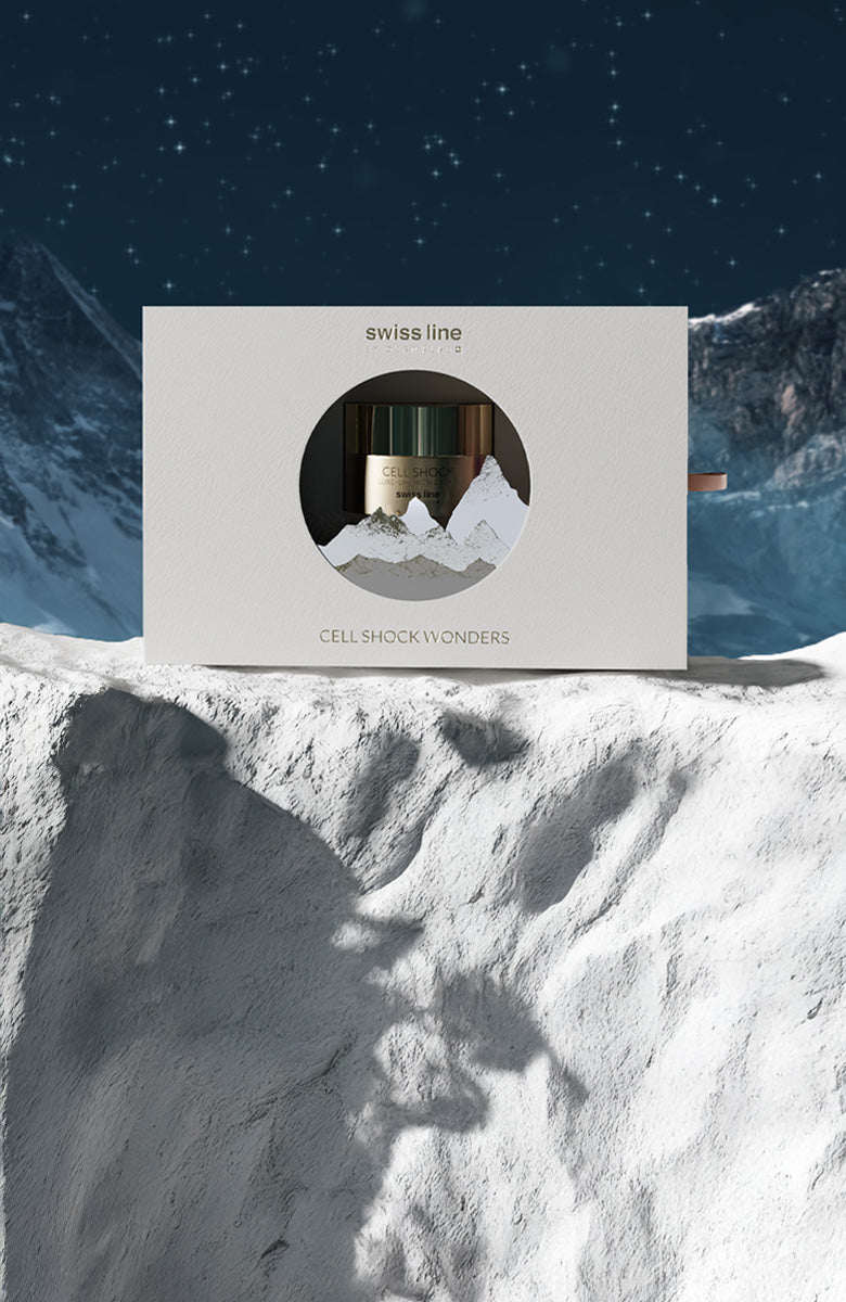 Swiss Line skincare product packaging on a snowy mountain background