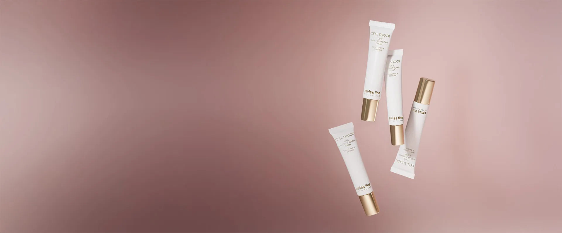 Skincare product tubes on a gradient pink background